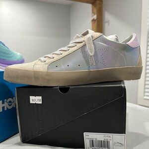 Shu Shop brand. New in box. Size 10. Shiny iridescent color